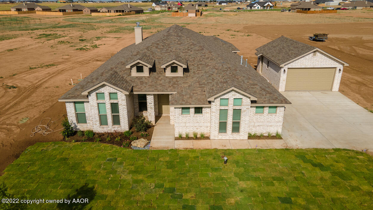2600 Daybreak Lane Amarillo, TX 79124 - Photo 2 of 36 a front view of a house with garden