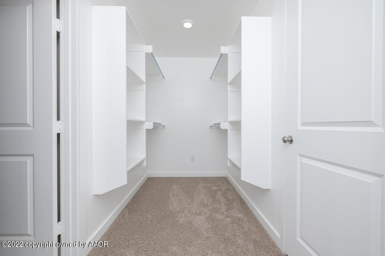 2600 Daybreak Lane Amarillo, TX 79124 - Photo 24 of 36 a view of a hallway with wooden floor and a bathroom