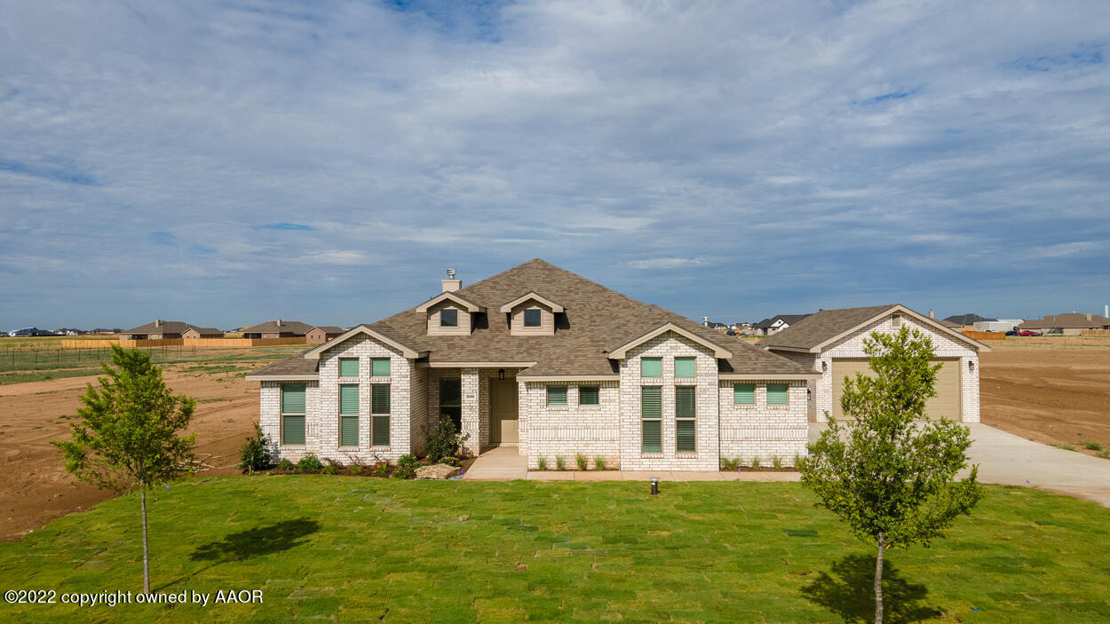 2600 Daybreak Lane Amarillo, TX 79124 - Photo 36 of 36 a front view of a house with a garden