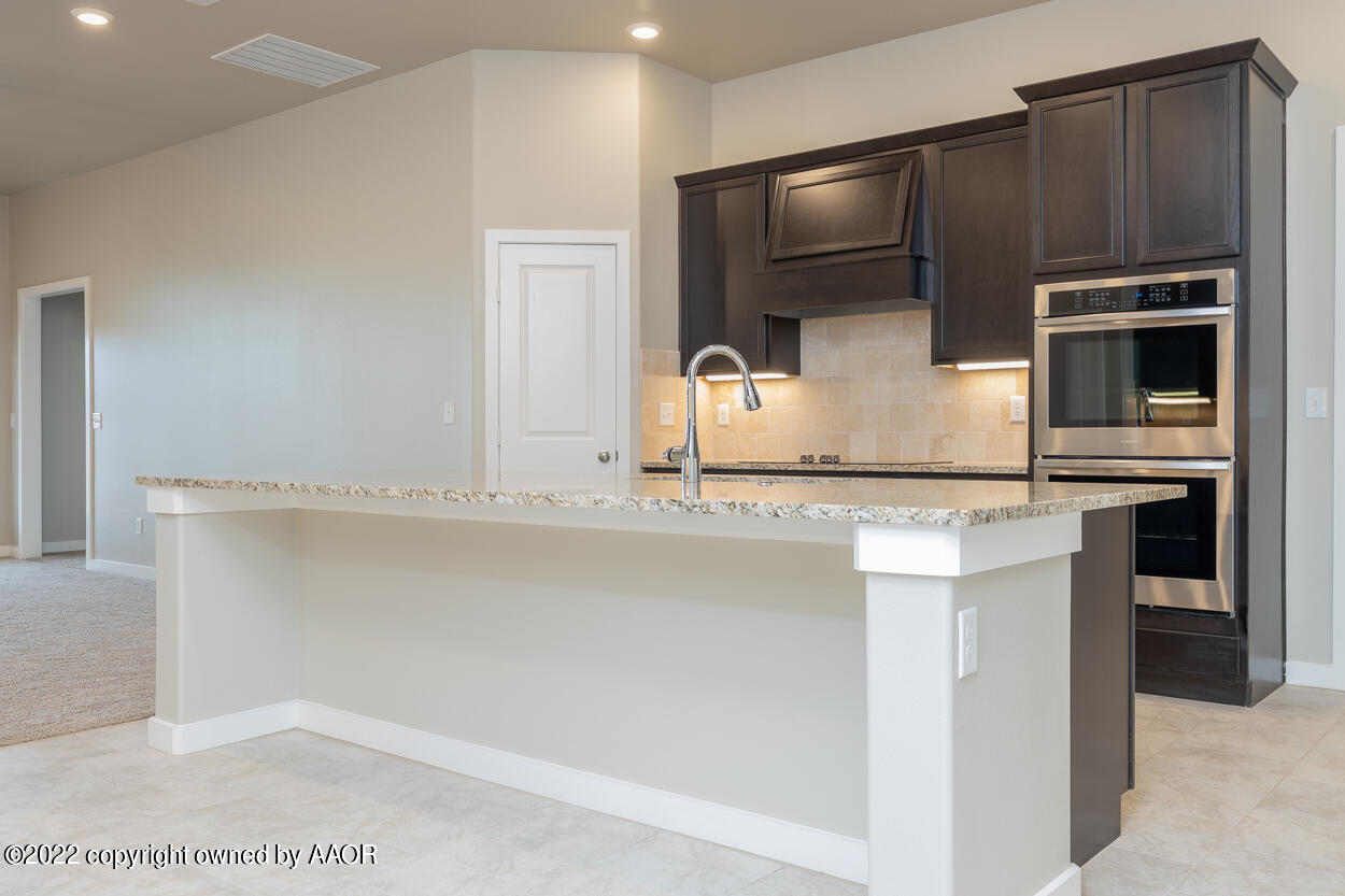 2600 Daybreak Lane Amarillo, TX 79124 - Photo 4 of 36 a kitchen with stainless steel appliances a sink and a refrigerator