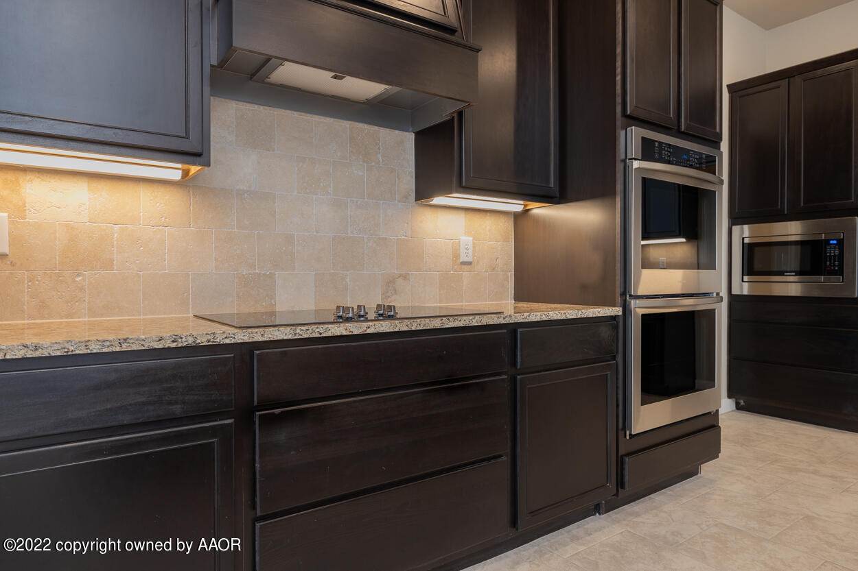 2600 Daybreak Lane Amarillo, TX 79124 - Photo 8 of 36 a kitchen with stainless steel appliances granite countertop a refrigerator and a sink