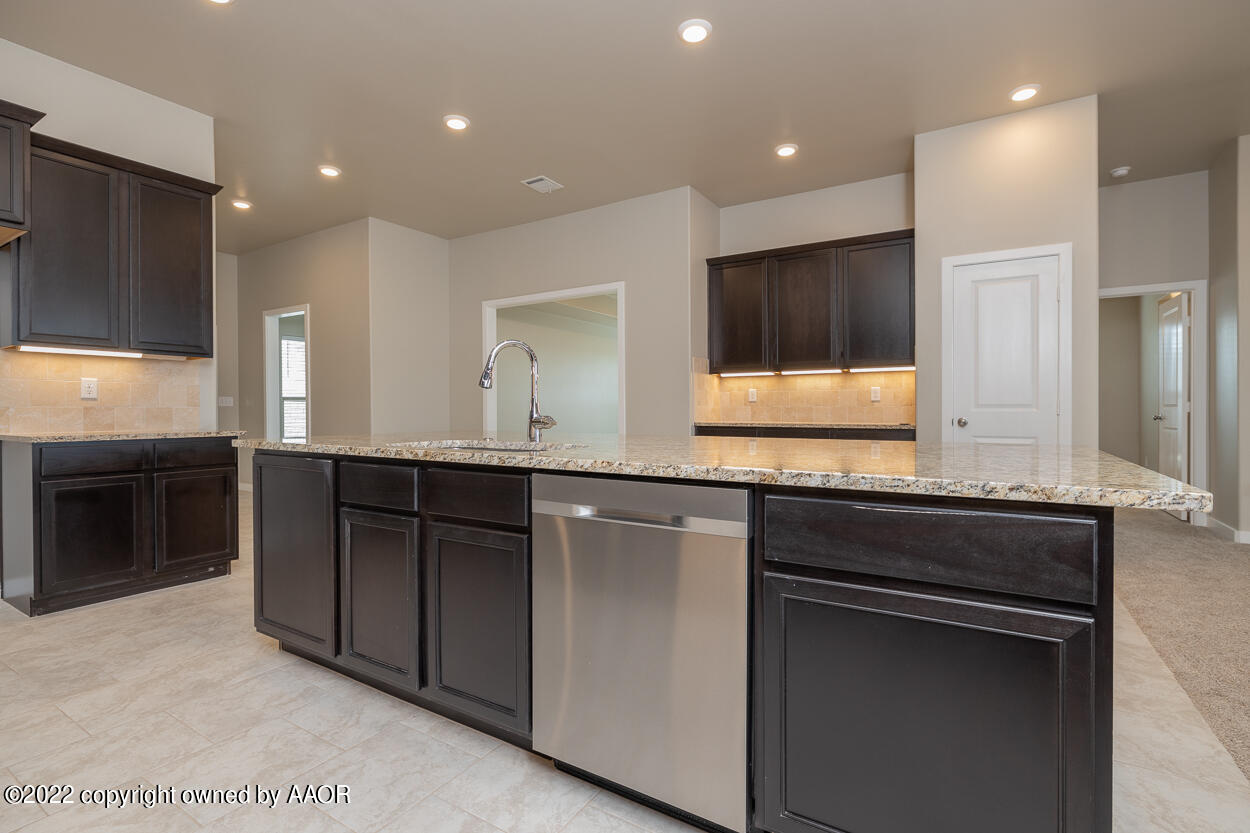 2600 Daybreak Lane Amarillo, TX 79124 - Photo 9 of 36 a kitchen with a sink and a refrigerator