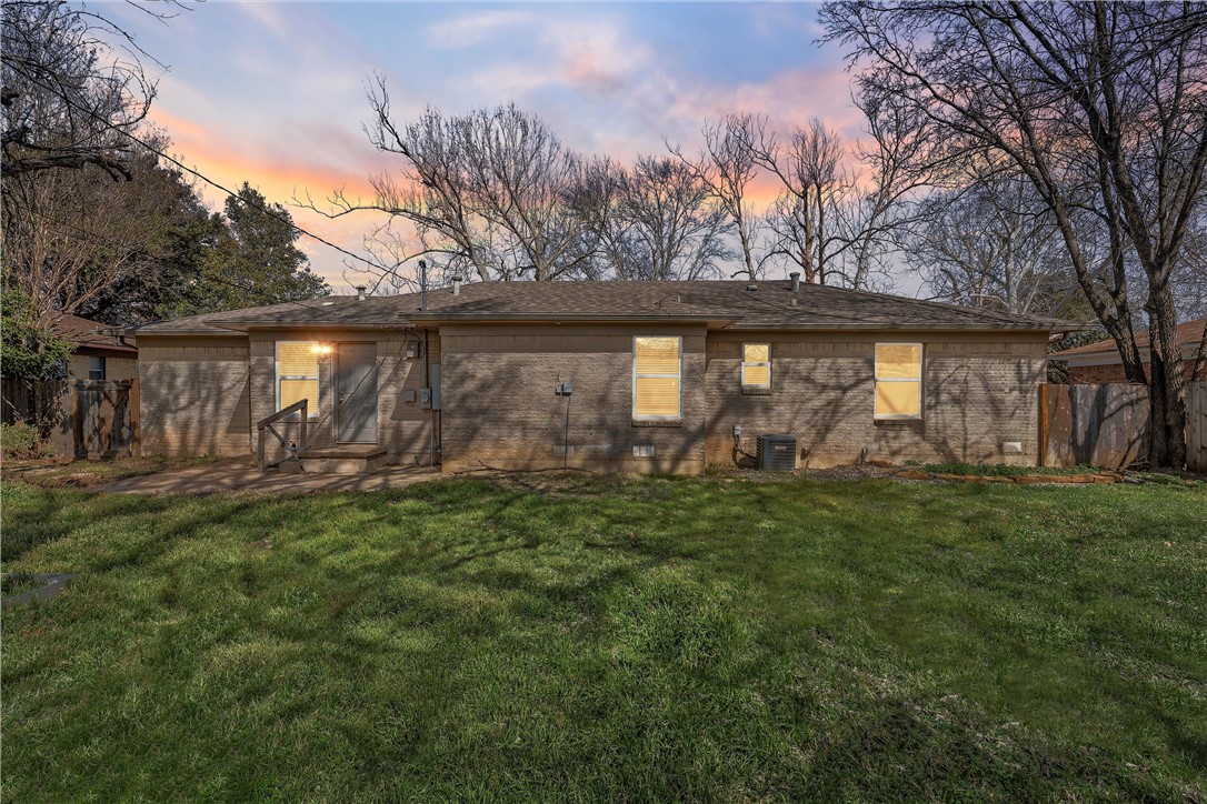 942 Longfellow Drive Waco, TX 76710 - Photo 29 of 38 a view of a backyard with table and chairs and potted plants