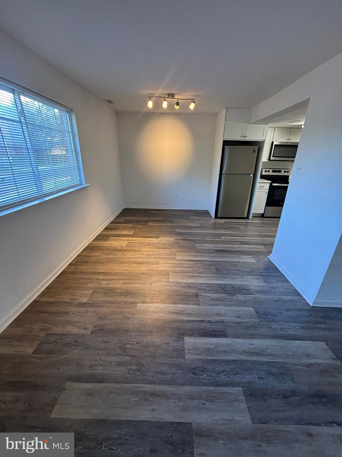 29 Poplar Street, Unit D7 Hatfield, PA 19440 - Photo 2 of 11 a view of empty room with wooden floor