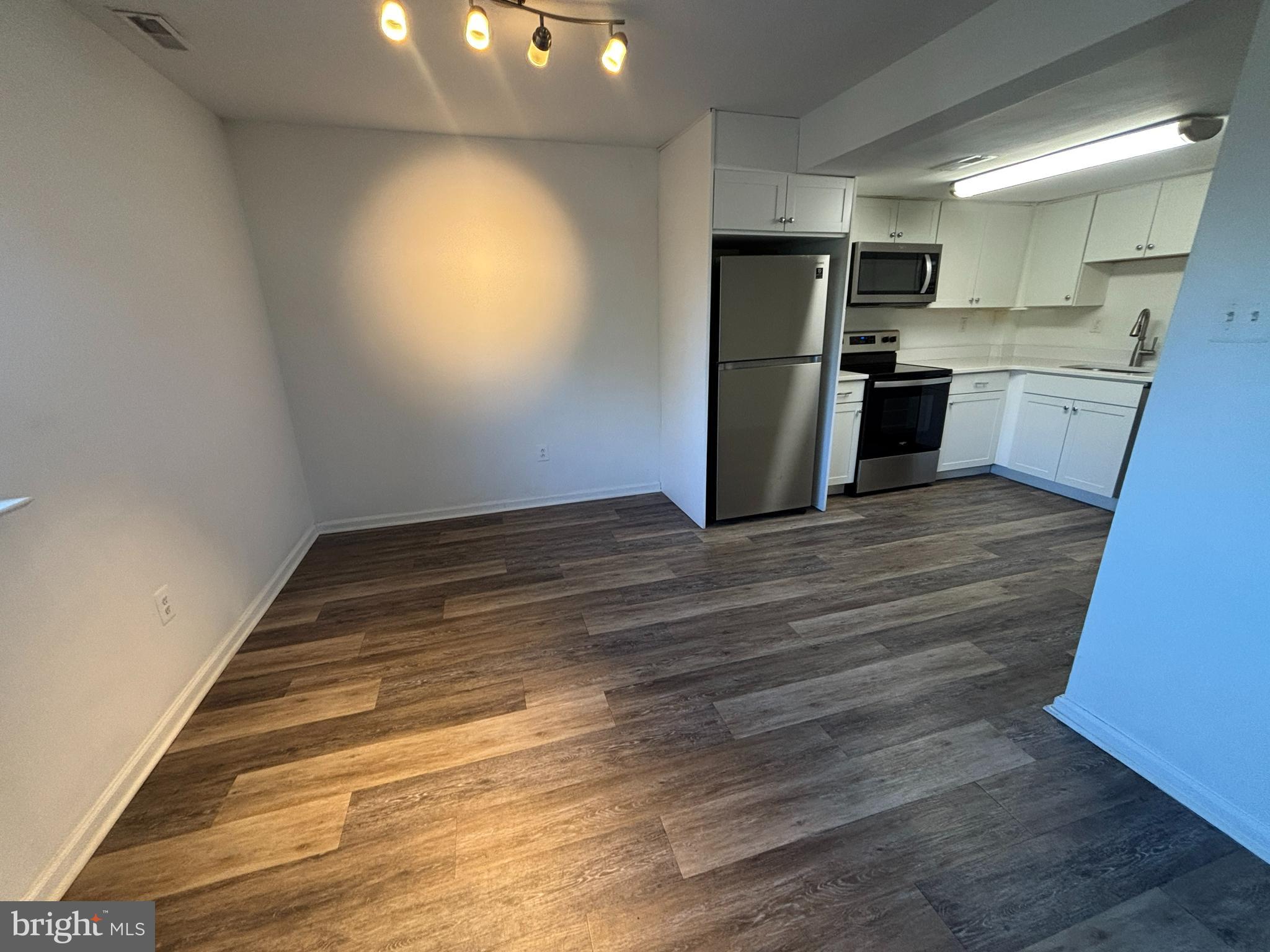 29 Poplar Street, Unit D7 Hatfield, PA 19440 - Photo 5 of 11 a kitchen with a refrigerator and a sink