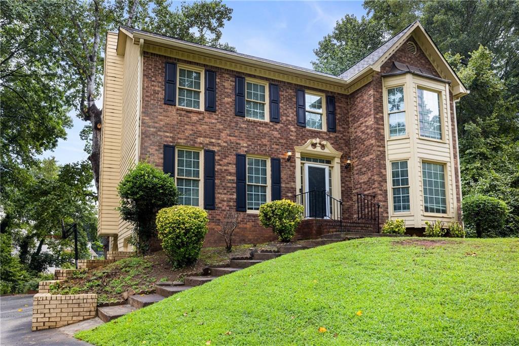 3773 Guilford Court Decatur, GA 30034 - Photo 1 of 1 a front view of a house with a yard and porch