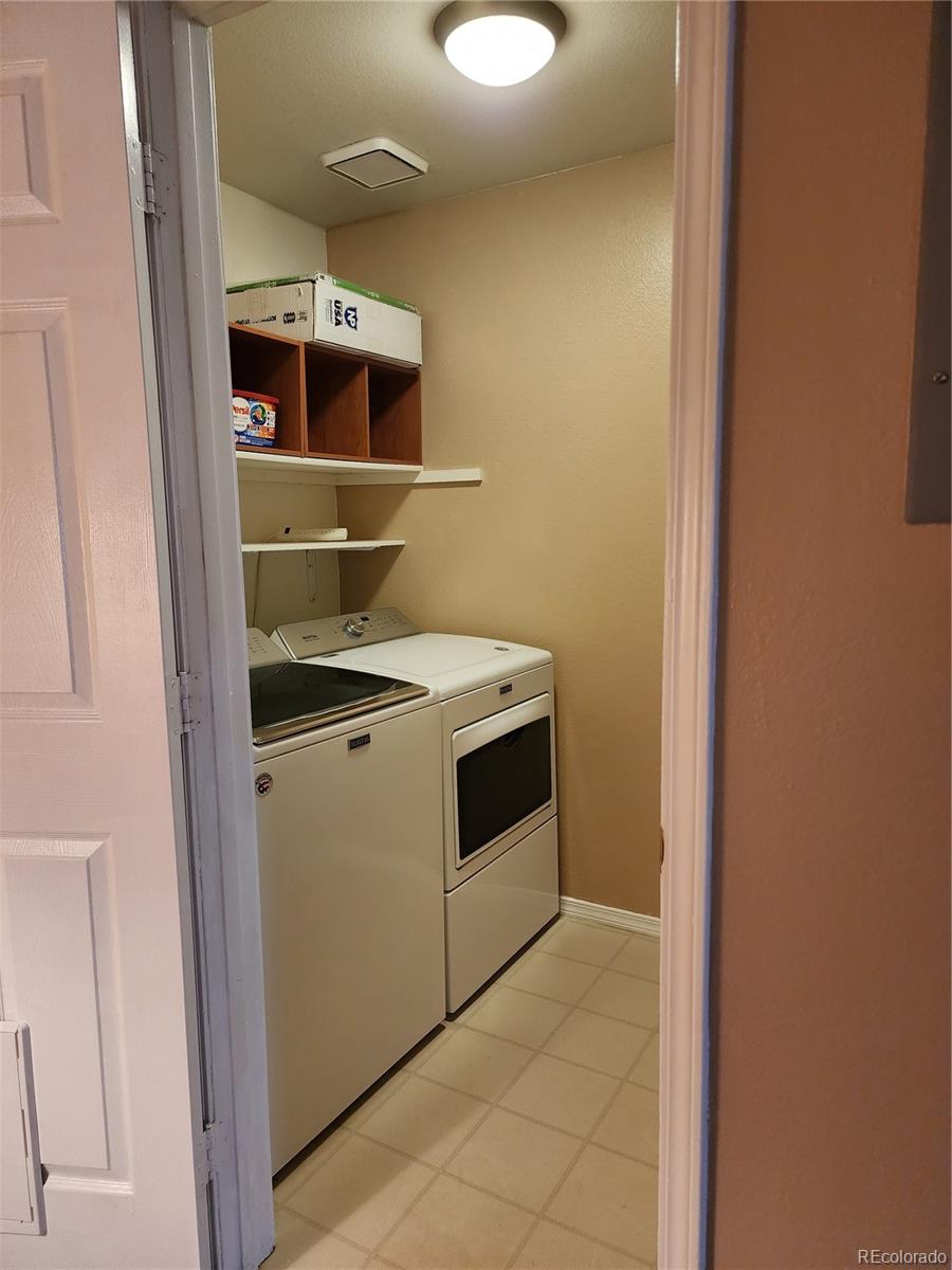 8601 East Dry Creek Road, Unit 112 Centennial, CO 80112 - Photo 12 of 19 a utility room with washer and dryer