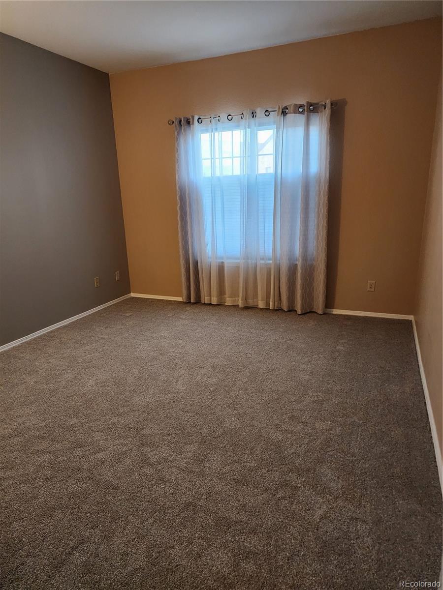 8601 East Dry Creek Road, Unit 112 Centennial, CO 80112 - Photo 13 of 19 an empty room with a door