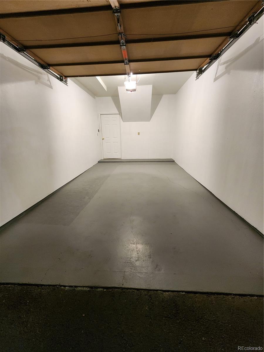 8601 East Dry Creek Road, Unit 112 Centennial, CO 80112 - Photo 19 of 19 a view of a garage