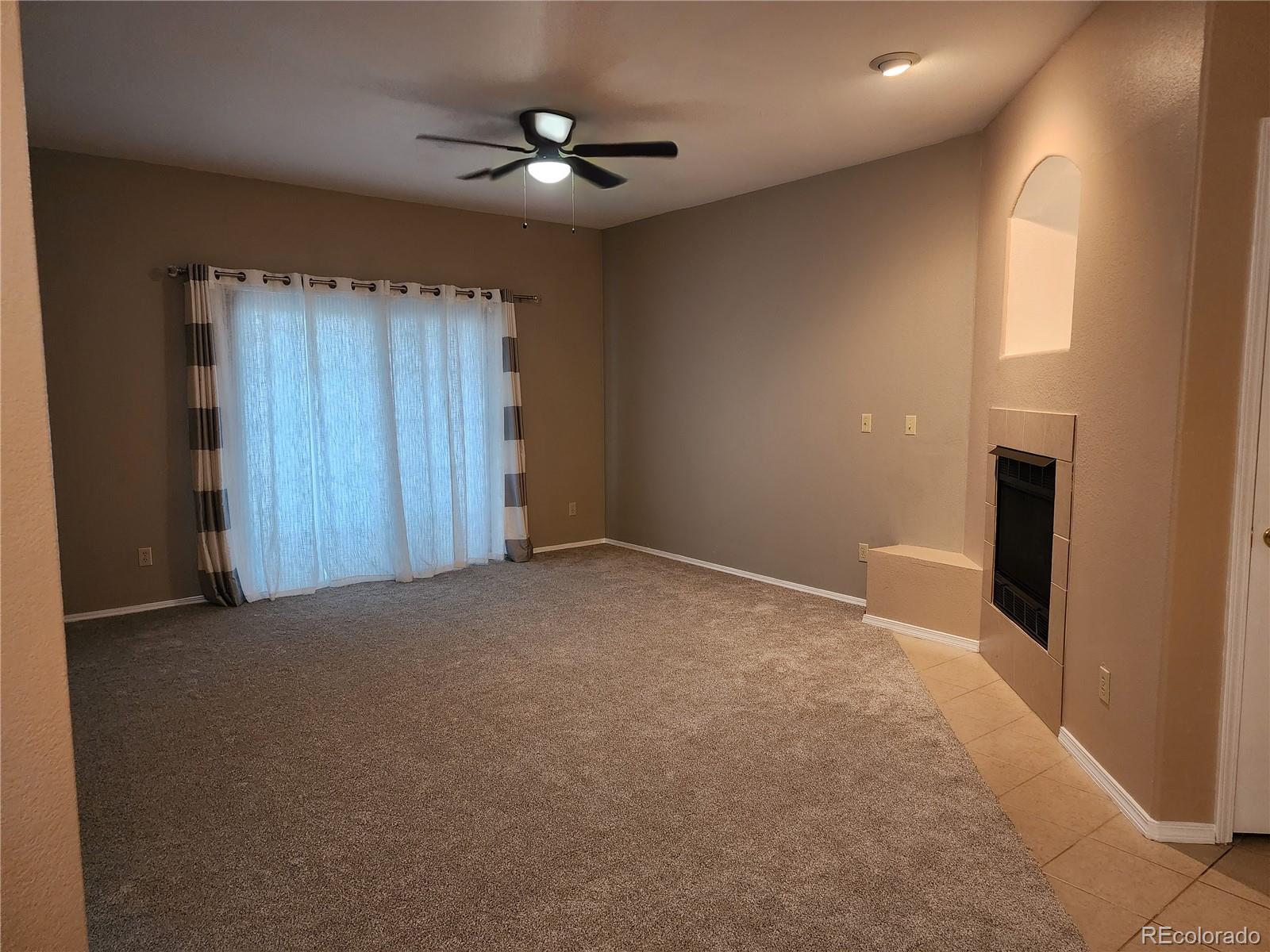 8601 East Dry Creek Road, Unit 112 Centennial, CO 80112 - Photo 6 of 19 an empty room with windows and fan