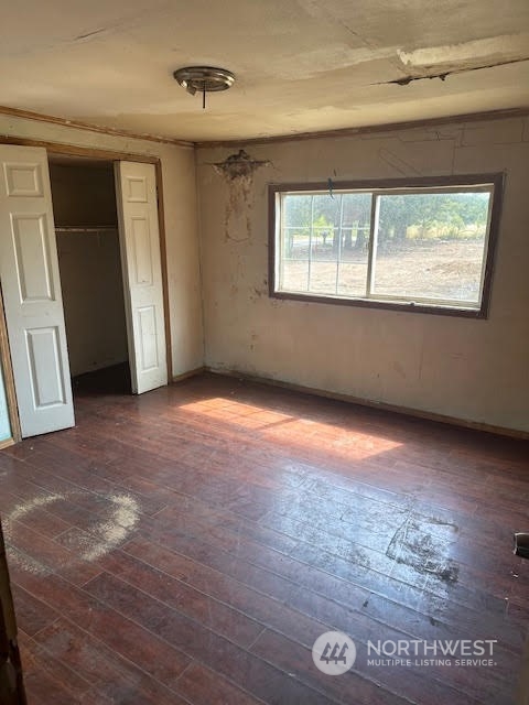 12201 Highway 12 Rochester, WA 98579 - Photo 12 of 18 an empty room with wooden floor and windows