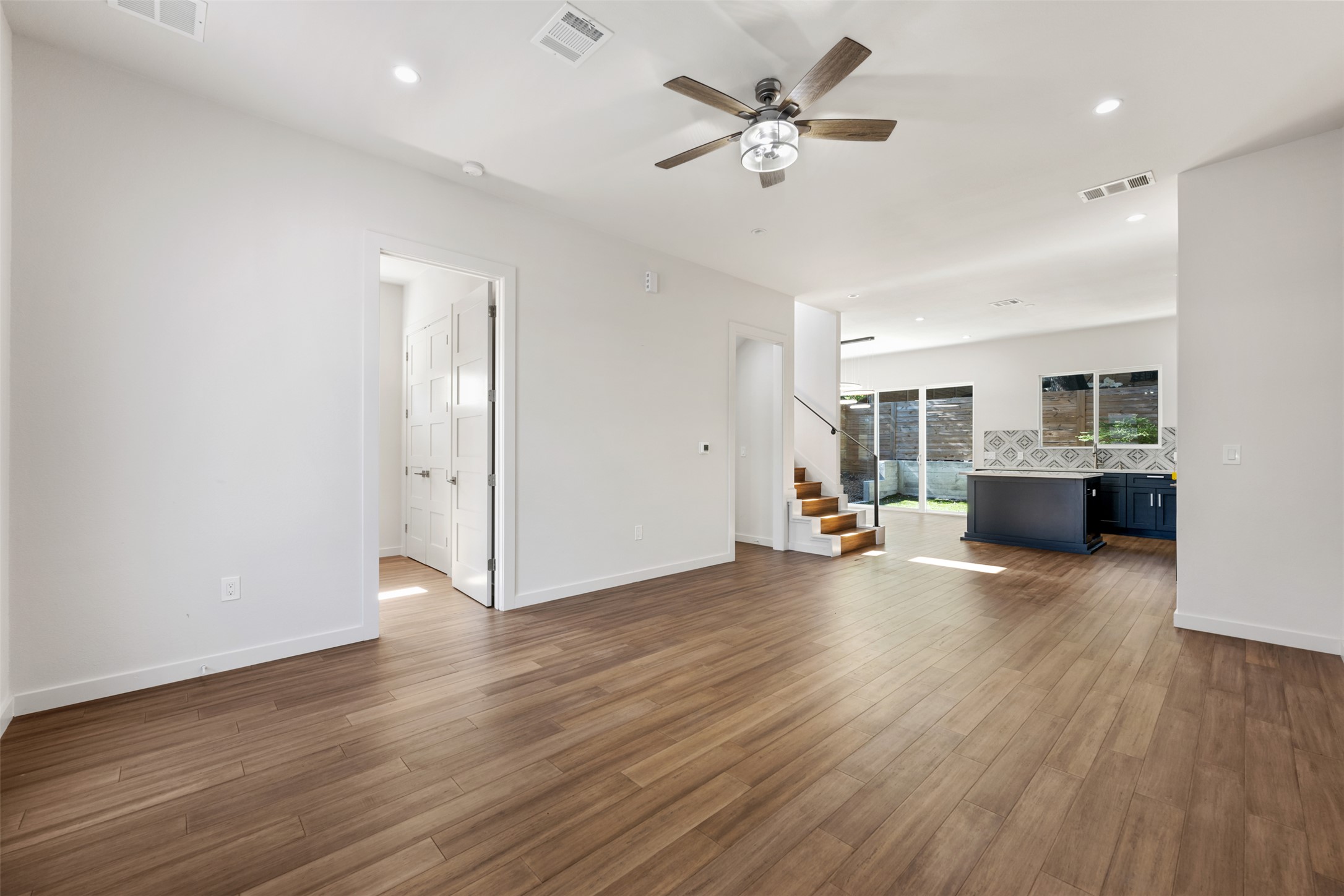3010 Webberville Road, Unit 1 Austin, TX 78702 - Photo 17 of 38 a view of a livingroom with hardwood floor and a ceiling fan