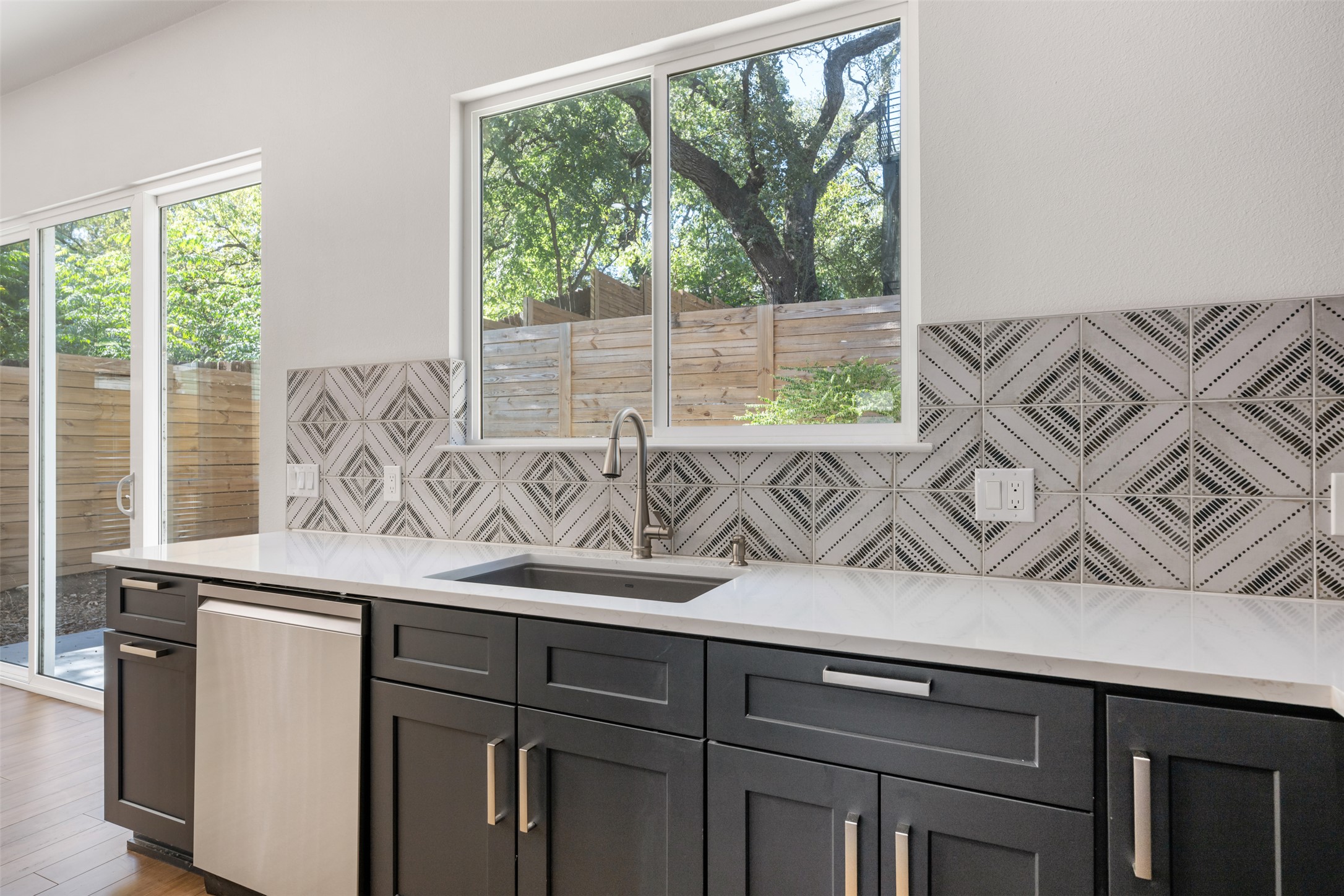 3010 Webberville Road, Unit 1 Austin, TX 78702 - Photo 23 of 38 a view of a sink a window and wooden floor