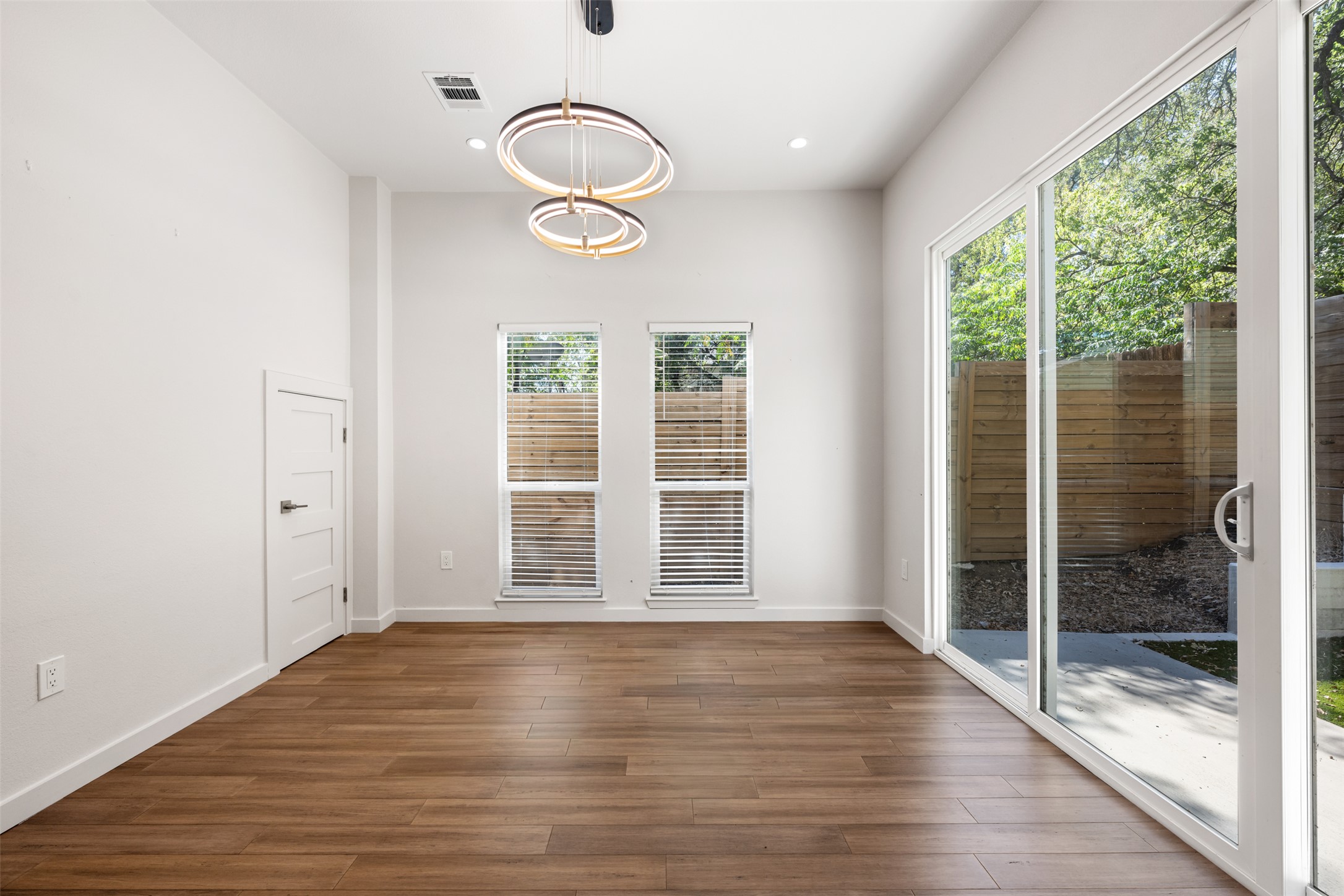 3010 Webberville Road, Unit 1 Austin, TX 78702 - Photo 25 of 38 an empty room with wooden floor and windows