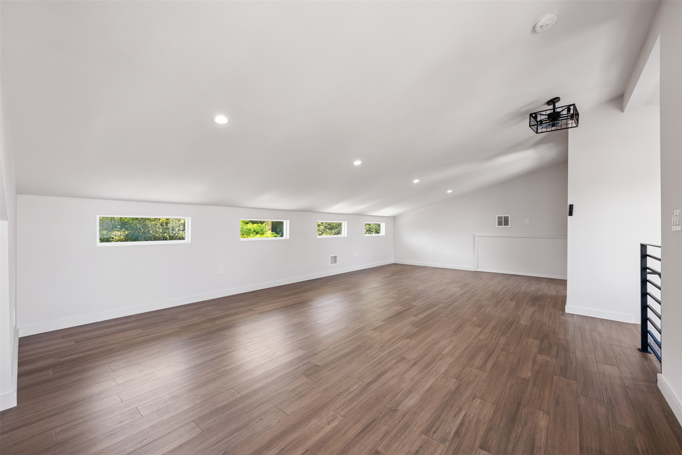 3010 Webberville Road, Unit 1 Austin, TX 78702 - Photo 8 of 38 an empty room with wooden floor and windows