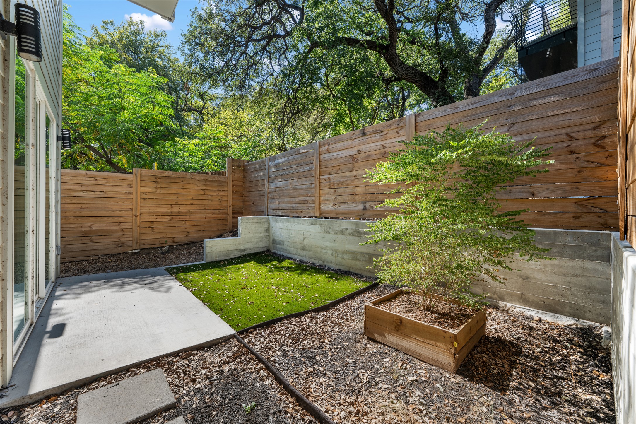 3010 Webberville Road, Unit 1 Austin, TX 78702 - Photo 10 of 38 a view of a backyard with sitting area