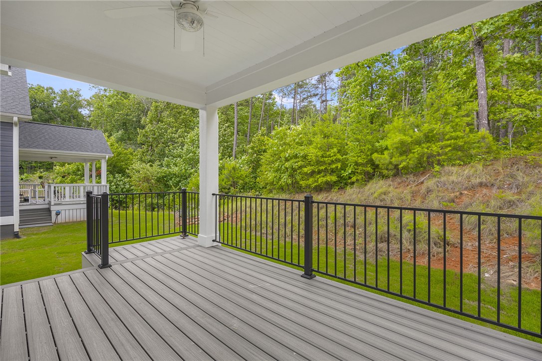 1230 Melton Road, Unit 216 West Union, SC 29696 - Photo 17 of 49 A spacious covered deck extends to a natural landscape, perfect for serene outdoor moments.
