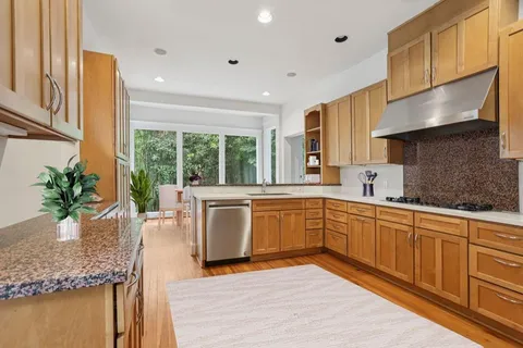 a kitchen with sink cabinets and outdoor view