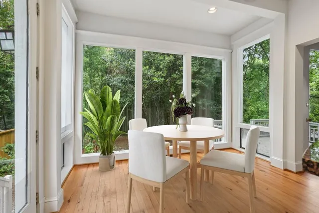 a view of a dining room with furniture window and wooden floor