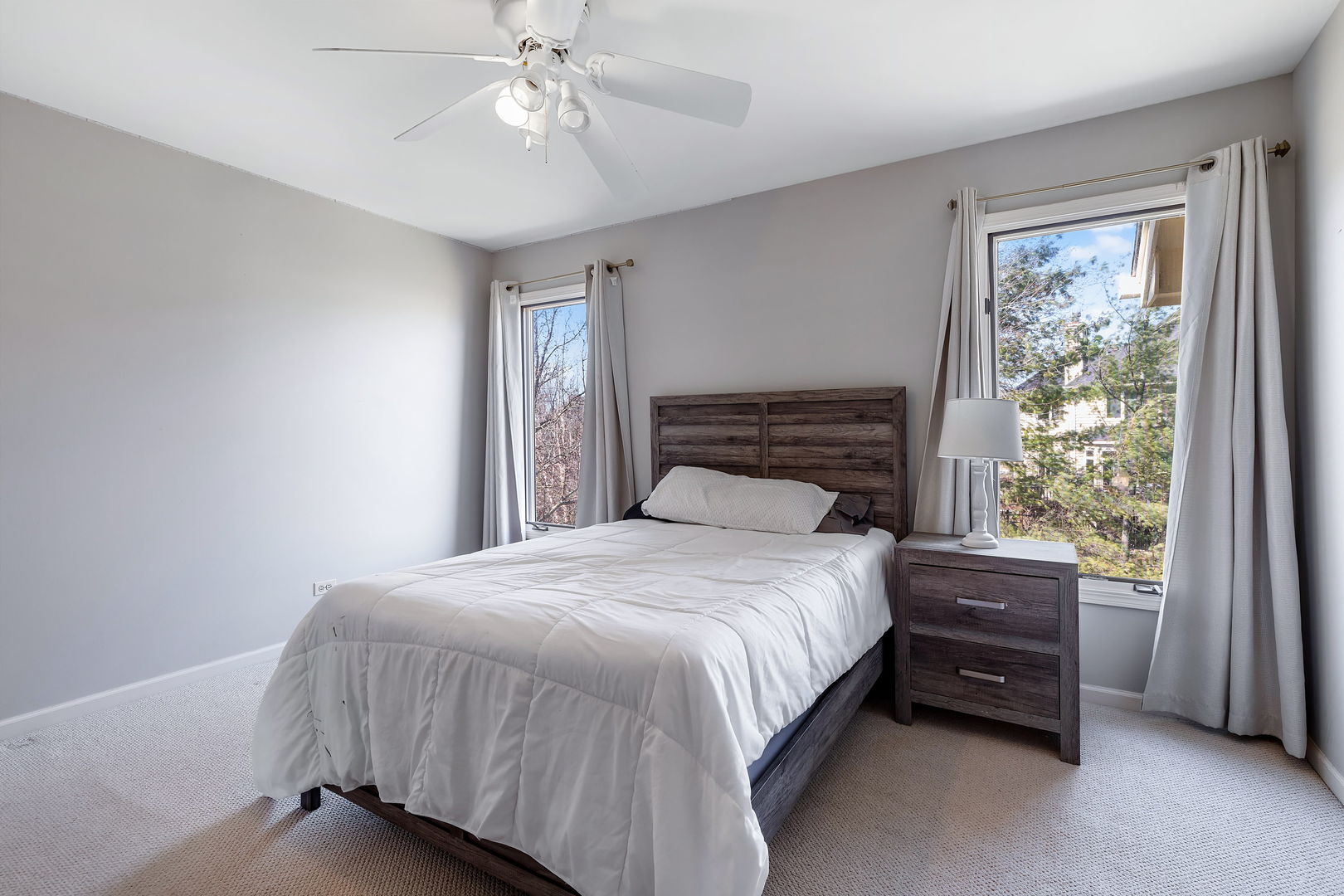 Undisclosed Address Aurora, IL 60502 - Photo 13 of 18 a bedroom with a bed and a chandelier