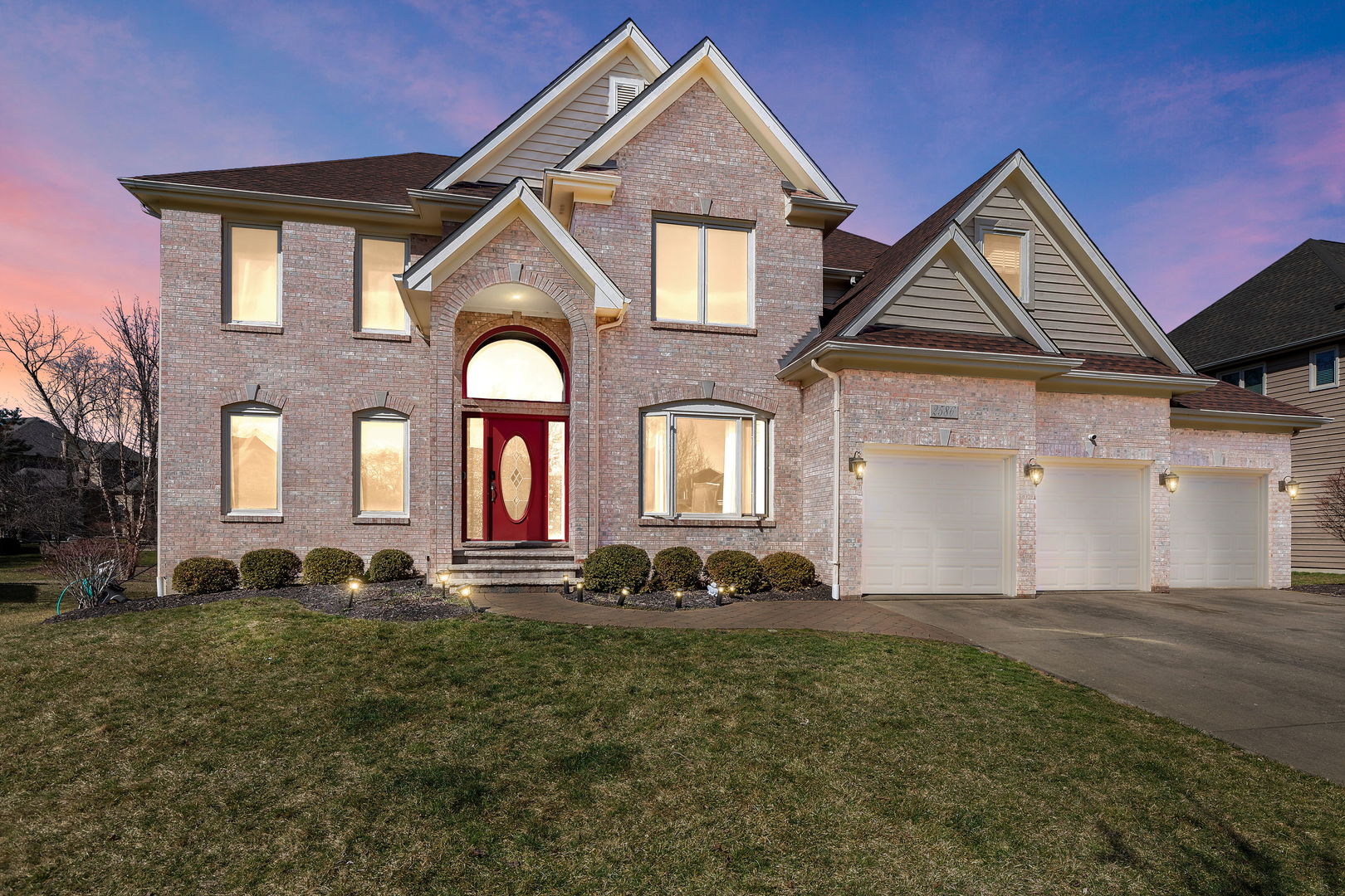 Undisclosed Address Aurora, IL 60502 - Photo 18 of 18 a front view of a house with a yard