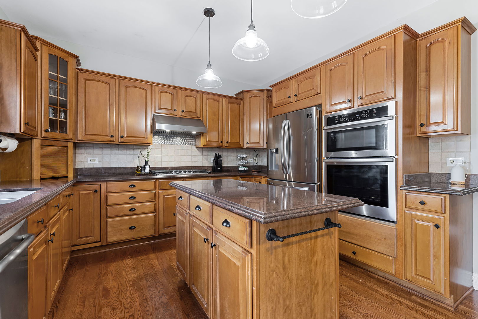 Undisclosed Address Aurora, IL 60502 - Photo 7 of 18 a kitchen with stainless steel appliances a stove refrigerator sink and microwave