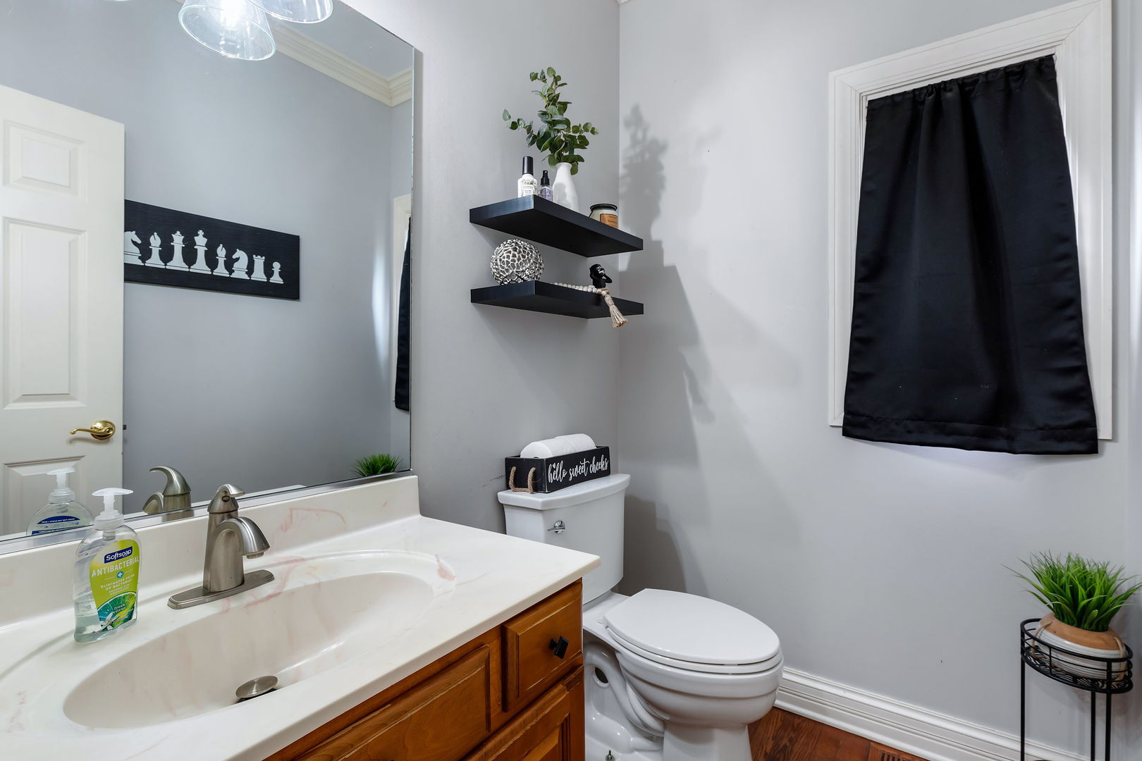 Undisclosed Address Aurora, IL 60502 - Photo 8 of 18 a bathroom with a sink a toilet and mirror