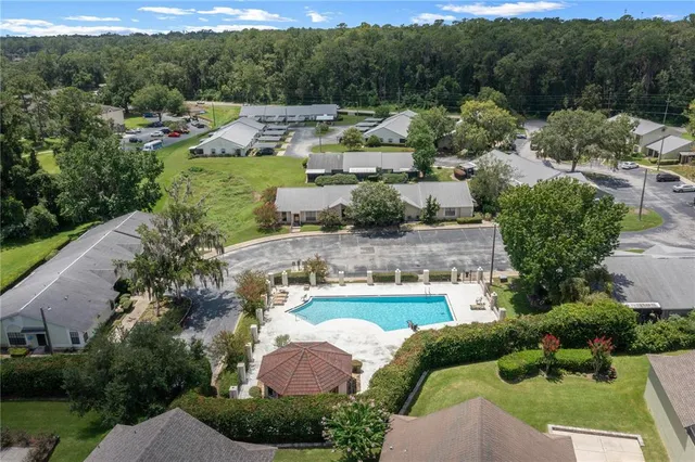 an aerial view of a house with outdoor space