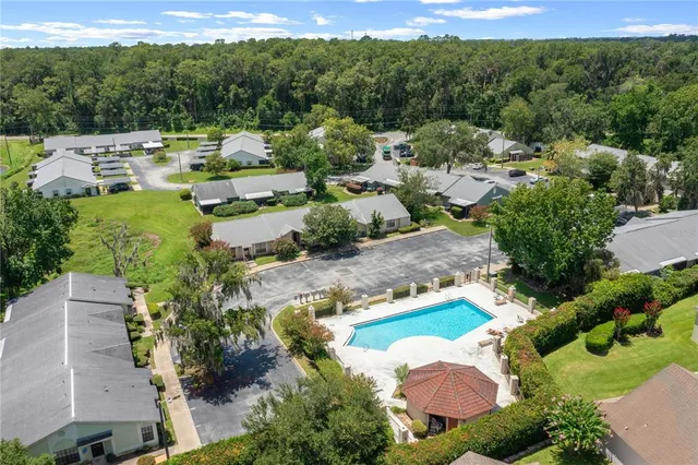 an aerial view of a house with mountain view