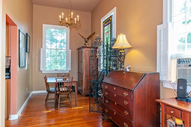 a view of a dining room with furniture and window