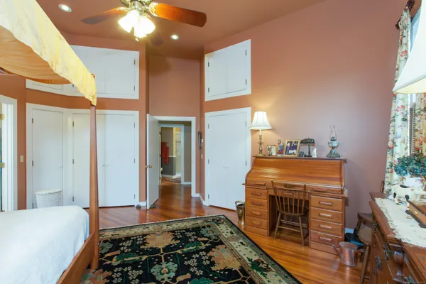 a bedroom with bed and a window