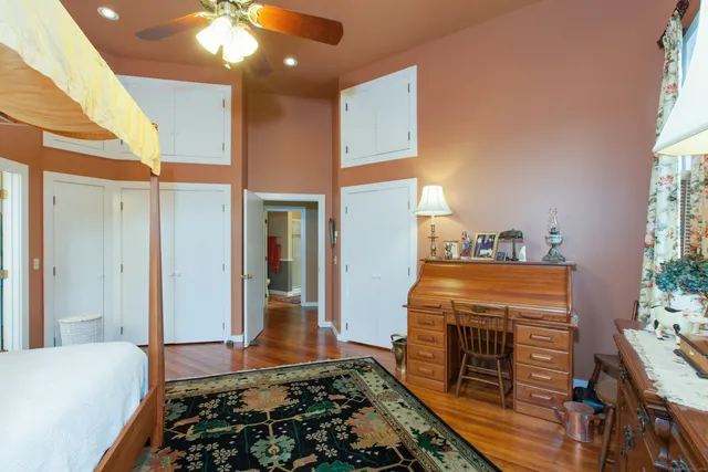 a bedroom with bed and a window