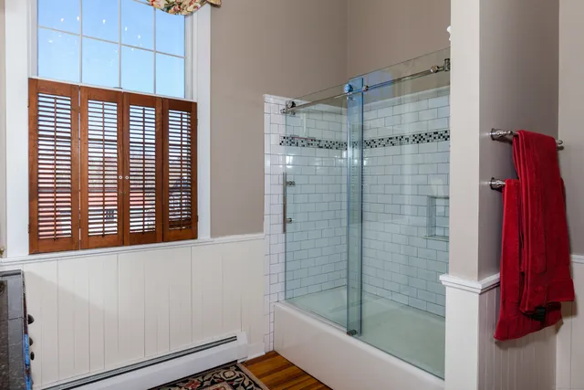a bathroom with a shower and a sink