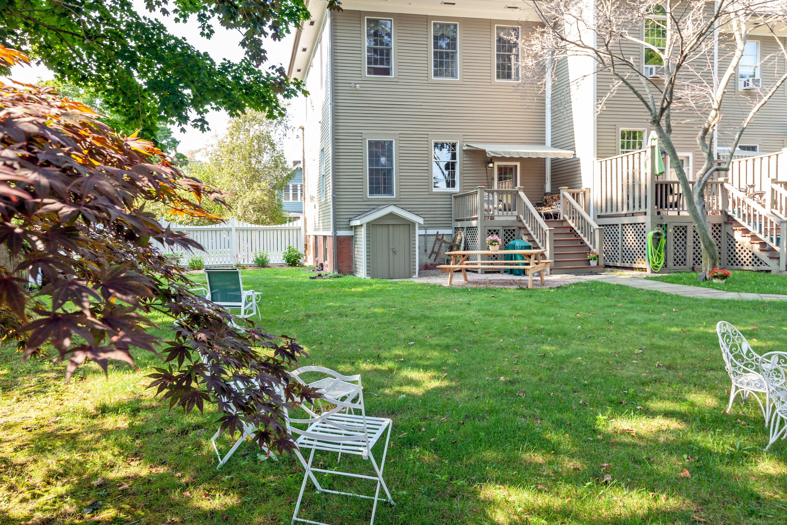 103 Boston Street, Unit C Guilford, CT 06437 - Photo 3 of 33 a front view of house with a garden and patio
