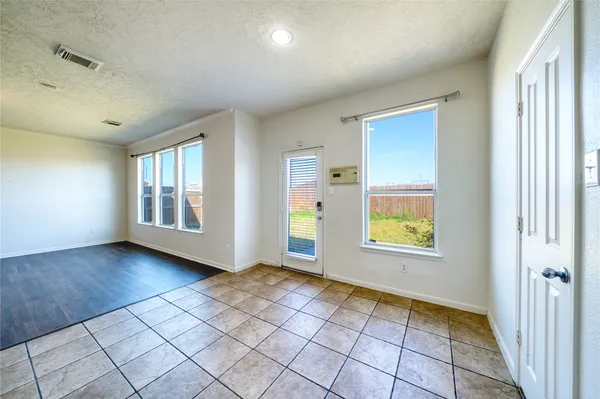 a view of an empty room and window