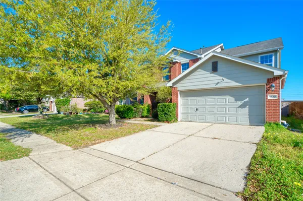 a front view of a house with yard
