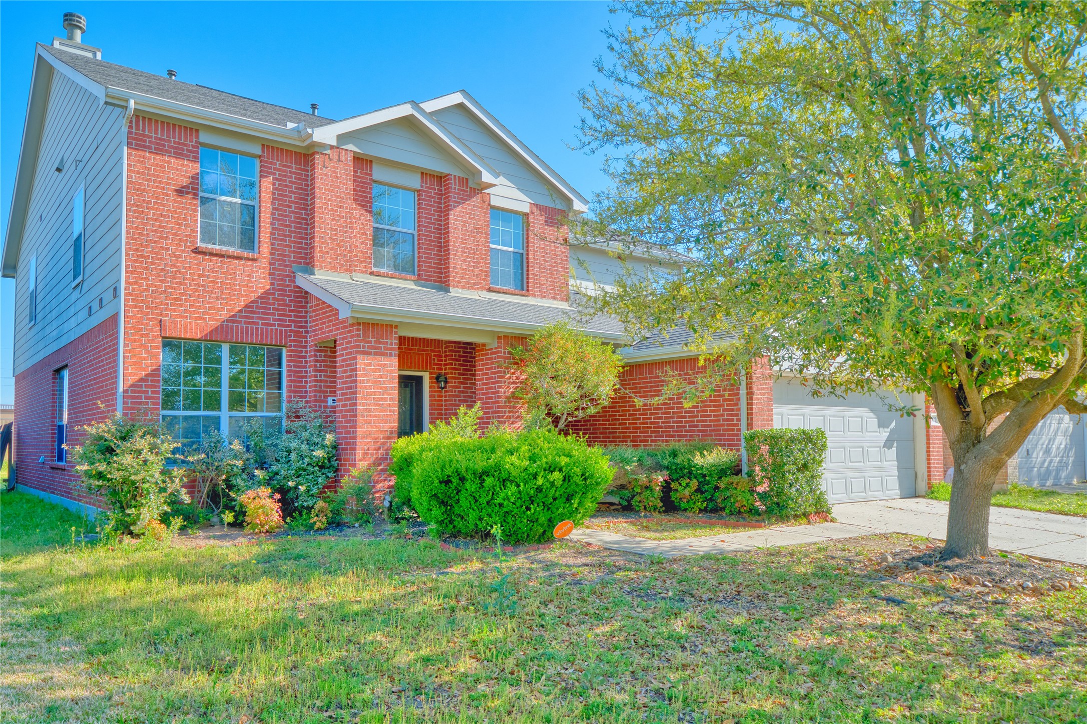 6610 Autumn Sunset Lane Spring, TX 77379 - Photo 3 of 45 a front view of a house with garden