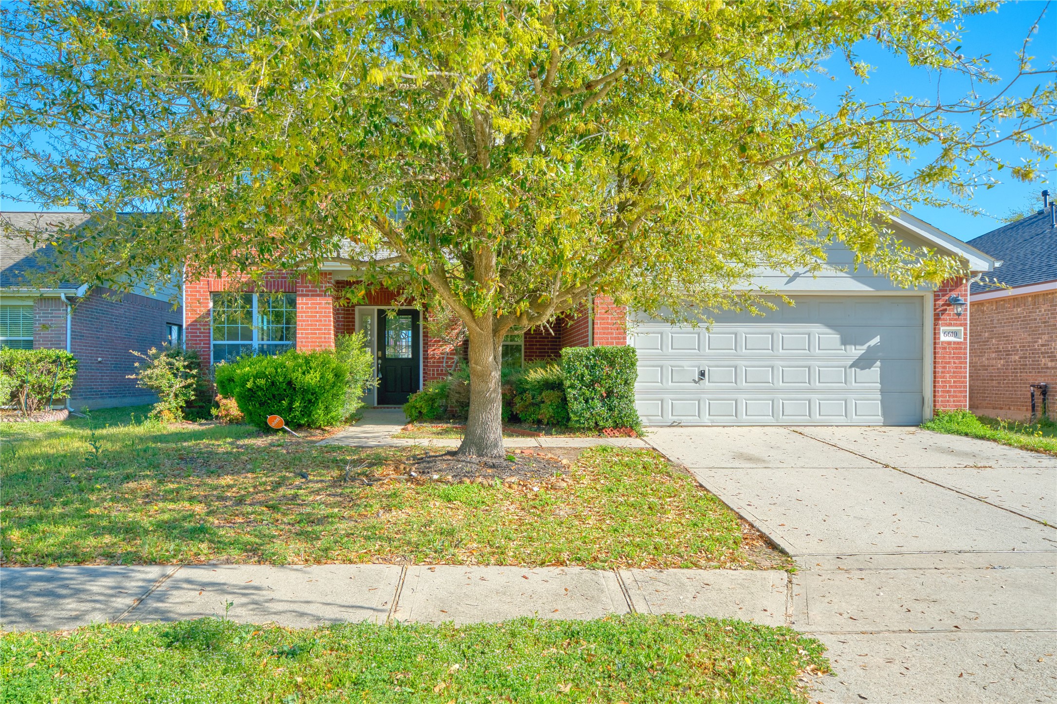 6610 Autumn Sunset Lane Spring, TX 77379 - Photo 5 of 45 a front view of a house with garden