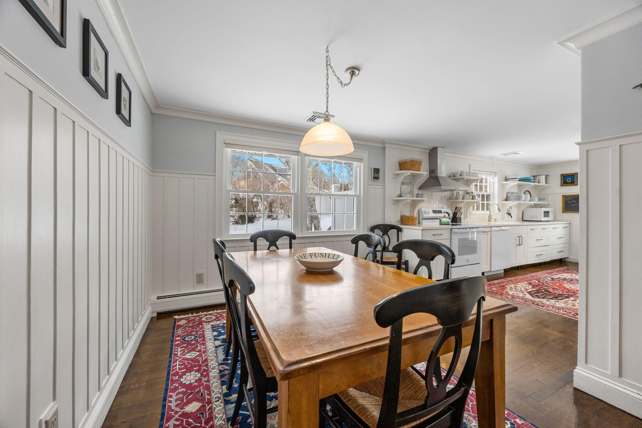 137 Shane Drive Chatham, MA 02633 - Photo 11 of 46 a dining room with wooden floor and a chandelier