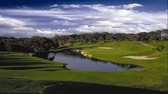 a view of a golf course with a lake