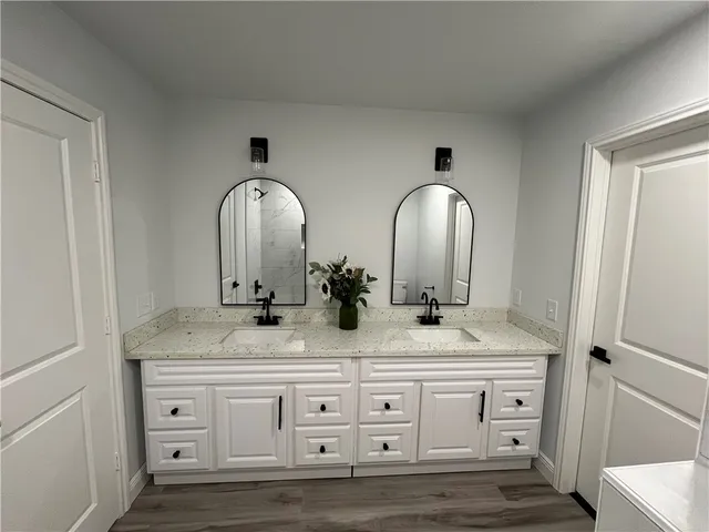 a bathroom with mirror and