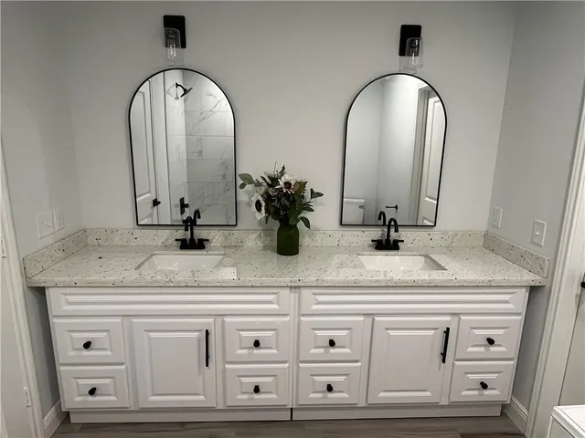 a bathroom with sink and mirror
