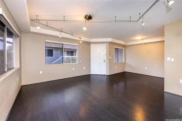 a view of a room with wooden floors