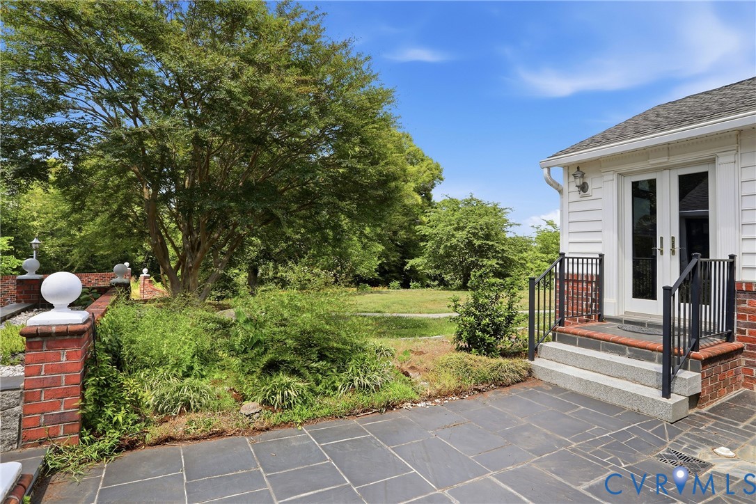 13300 West Patrick Henry Road Doswell, VA 23047 - Photo 50 of 69 Exterior patio with dark slate-style pavers and a