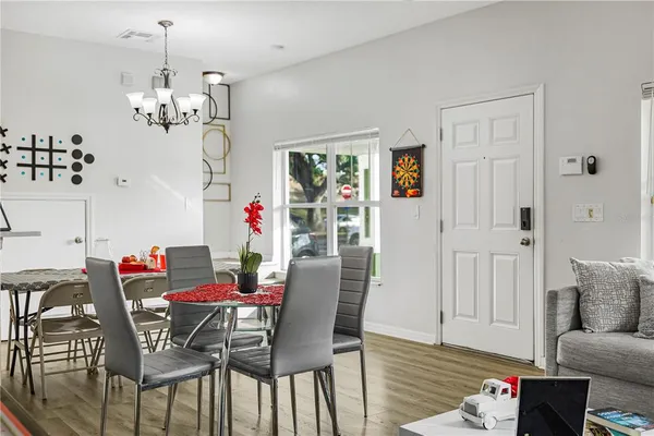a view of a dining room with furniture window and wooden floor