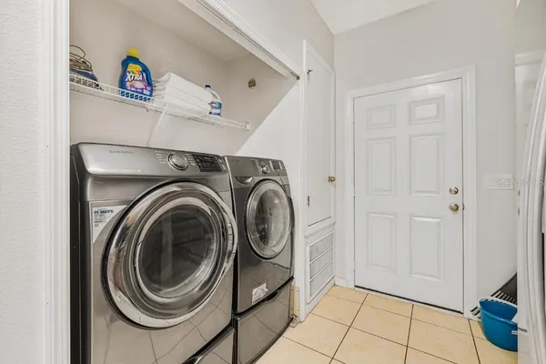 a view of storage and utility room with washer and dryer