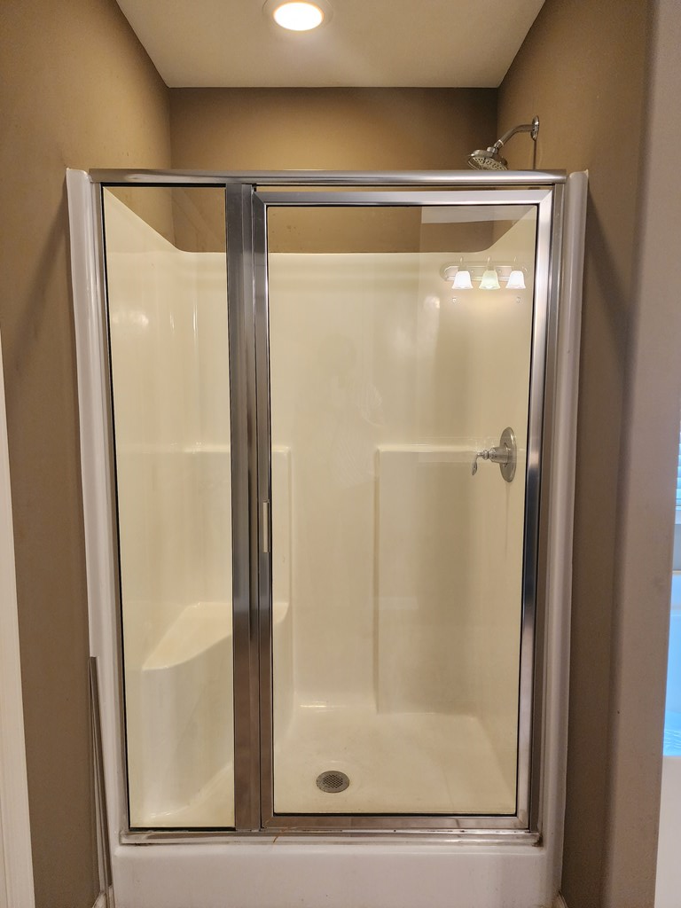 4924 Brightstar Lane Columbus, GA 31907 - Photo 16 of 21 a bathroom with a glass shower door