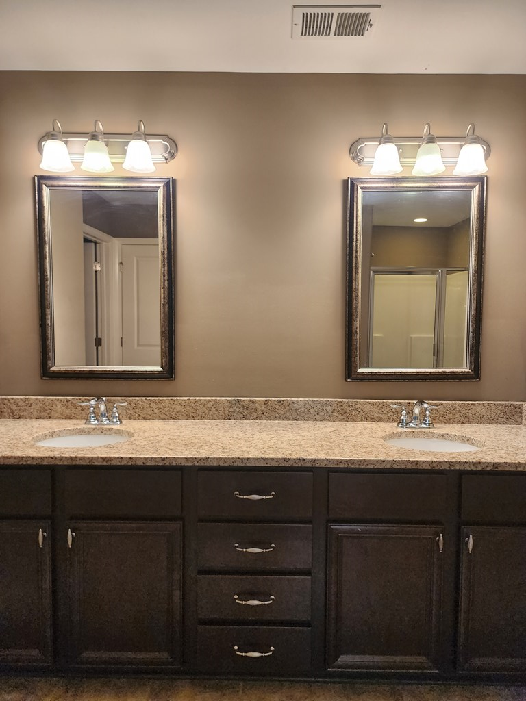 4924 Brightstar Lane Columbus, GA 31907 - Photo 18 of 21 a bathroom with a double vanity sink and a mirror