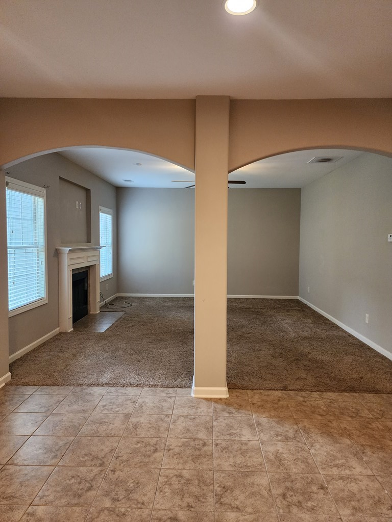 4924 Brightstar Lane Columbus, GA 31907 - Photo 5 of 21 an empty room with windows and fireplace
