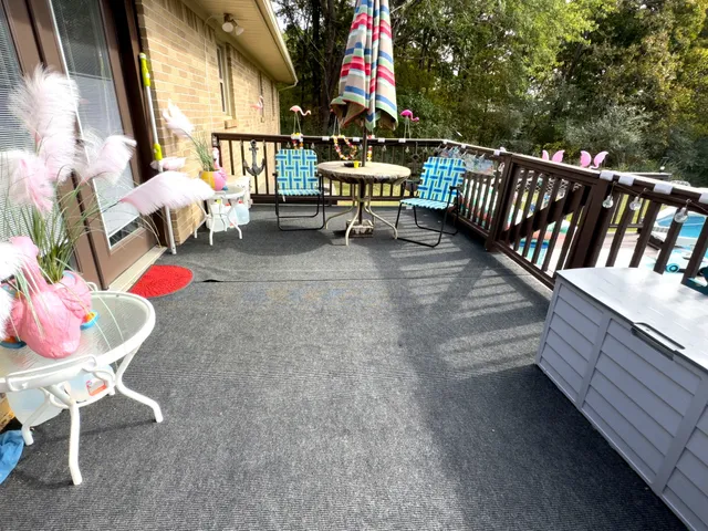 a view of a backyard with furniture and entertaining space
